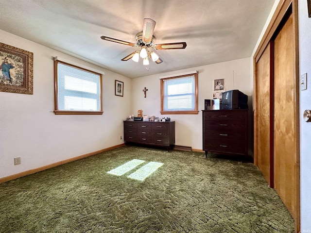 unfurnished bedroom with a ceiling fan, carpet, a closet, and baseboards