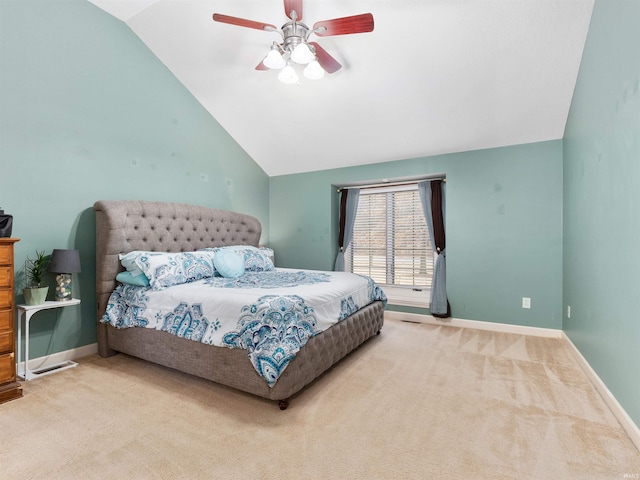 carpeted bedroom with lofted ceiling, ceiling fan, and baseboards