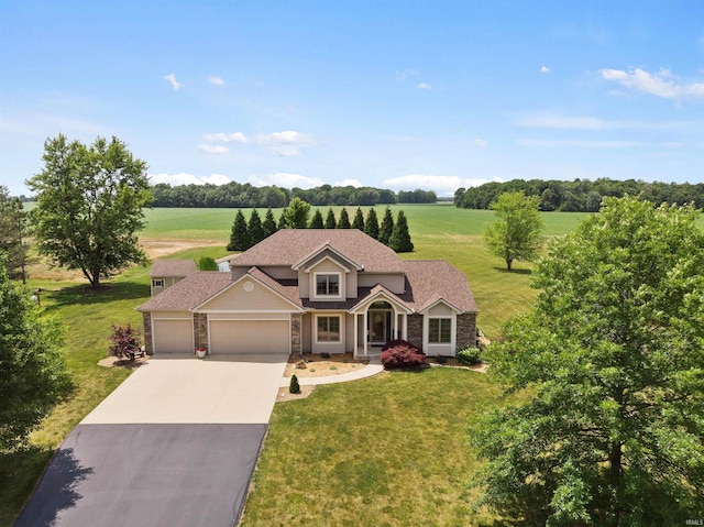 traditional home with a garage, concrete driveway, stone siding, roof with shingles, and a front lawn