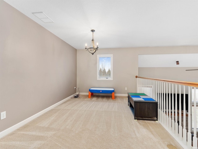 recreation room with a notable chandelier, visible vents, baseboards, and carpet flooring