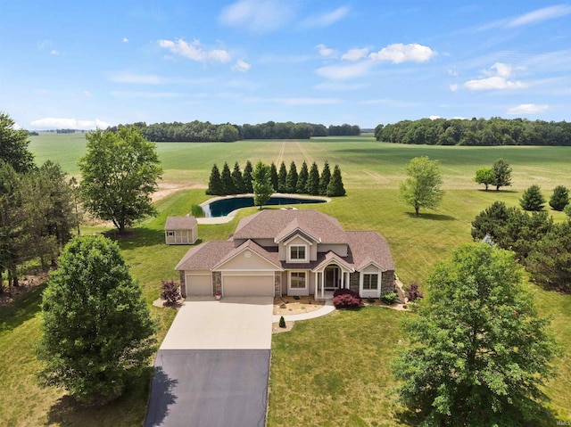 birds eye view of property with a rural view