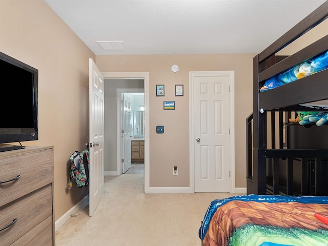 carpeted bedroom with baseboards