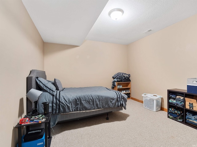 bedroom featuring carpet flooring, visible vents, and baseboards