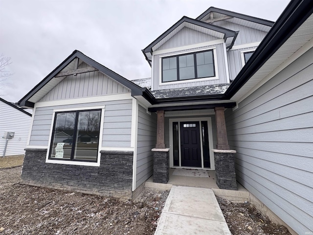 view of exterior entry featuring stone siding