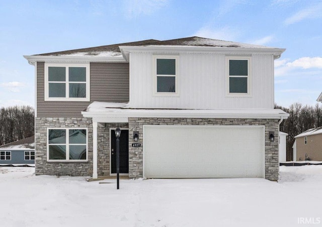 traditional-style house featuring stone siding and an attached garage