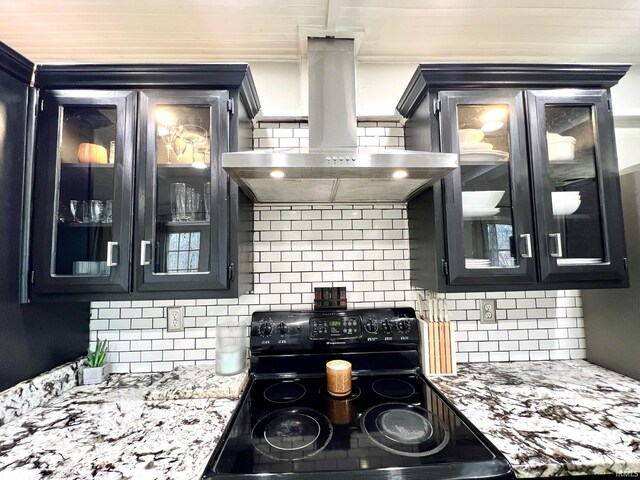 kitchen featuring black electric range, island range hood, and dark cabinets