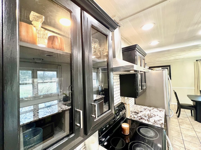 kitchen with black / electric stove, light tile patterned floors, recessed lighting, wood ceiling, and baseboards