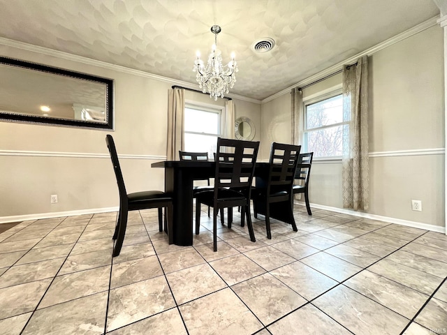 dining space featuring ornamental molding, visible vents, and an inviting chandelier