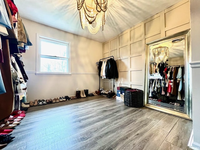 mudroom with a decorative wall and wood finished floors