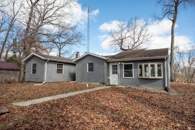 single story home with a chimney