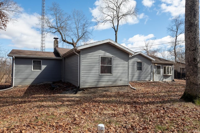 view of side of property with a chimney