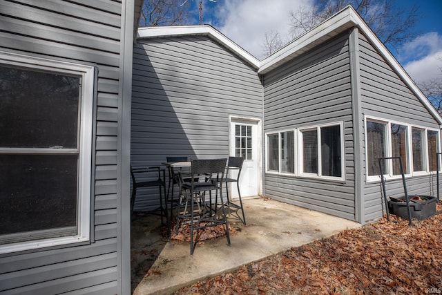 rear view of property featuring a patio