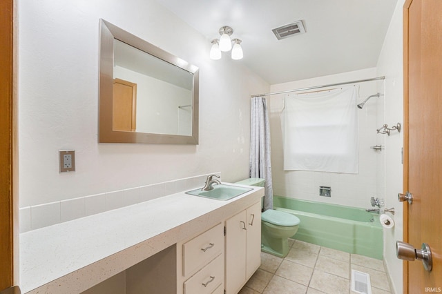 bathroom featuring toilet, tile patterned flooring, visible vents, and vanity