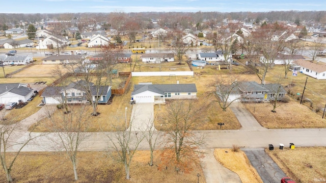 birds eye view of property with a residential view