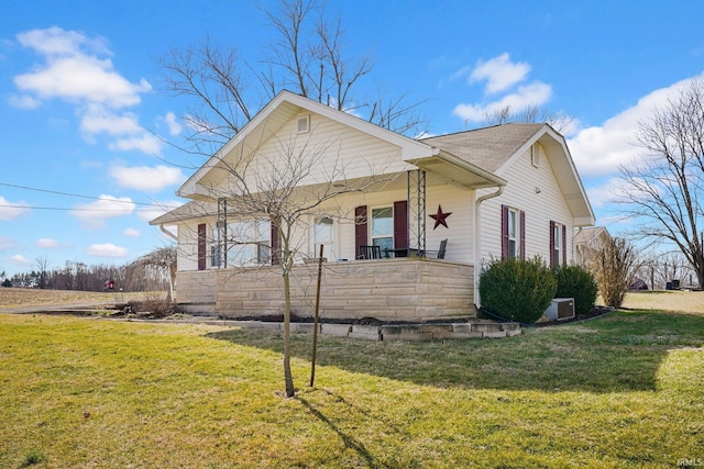 bungalow-style home with a porch and a front yard