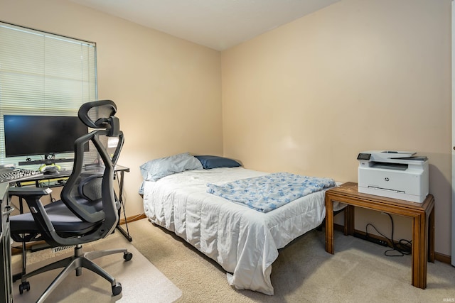 bedroom featuring baseboards and carpet floors