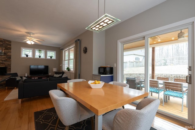 dining space featuring a ceiling fan and hardwood / wood-style flooring