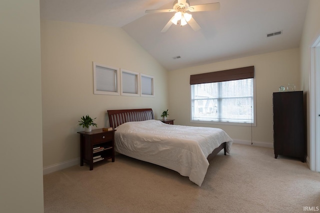 bedroom with visible vents, baseboards, vaulted ceiling, and light colored carpet