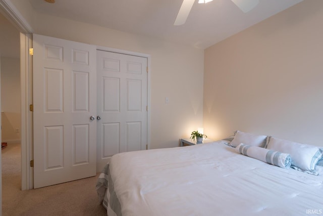 carpeted bedroom featuring a closet and a ceiling fan