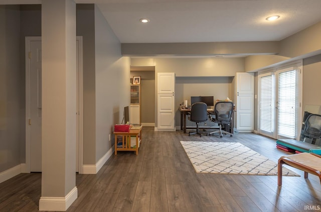 office space with baseboards, dark wood finished floors, and recessed lighting