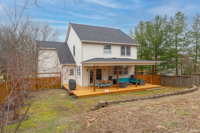 back of property featuring a fenced backyard, outdoor lounge area, a shingled roof, and a wooden deck