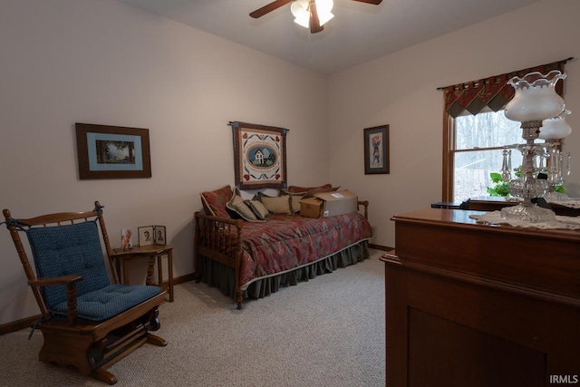 bedroom with baseboards, a ceiling fan, and light colored carpet