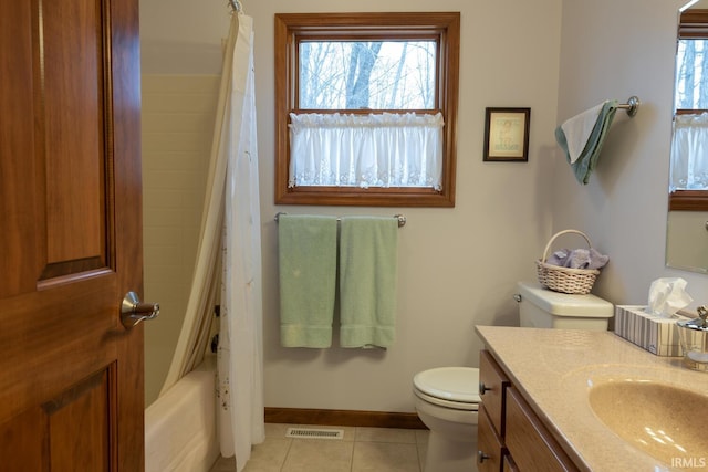 bathroom featuring tile patterned flooring, toilet, visible vents, vanity, and baseboards