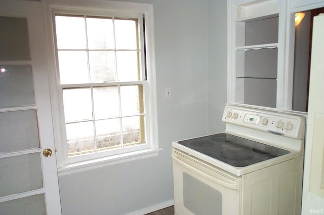 kitchen with plenty of natural light and white electric range oven