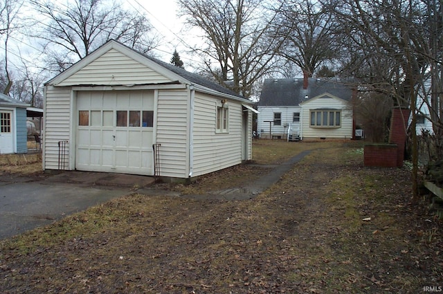 detached garage with aphalt driveway