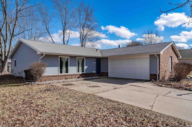 ranch-style house featuring a shingled roof, brick siding, driveway, and an attached garage