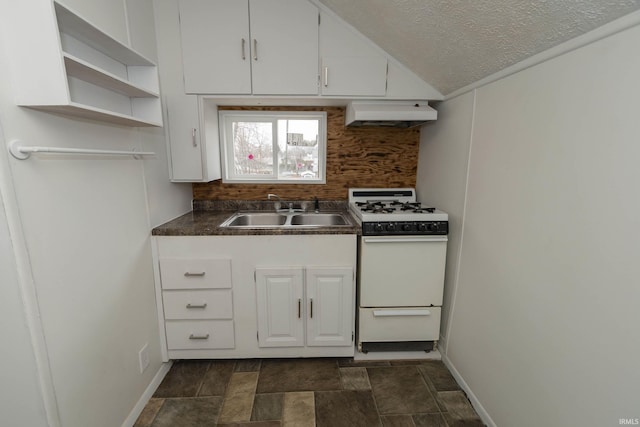 kitchen featuring under cabinet range hood, a sink, white cabinetry, backsplash, and white gas range