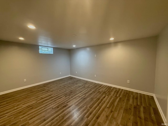 basement with dark wood-type flooring, recessed lighting, and baseboards