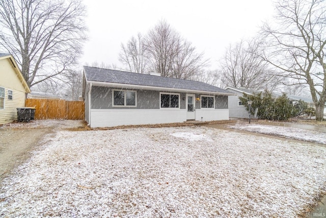 ranch-style house with fence