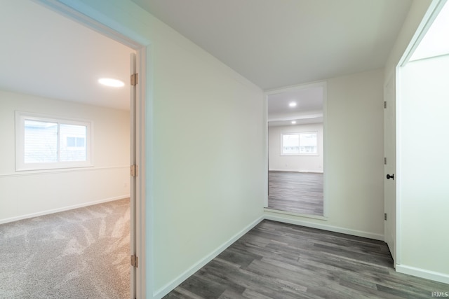 unfurnished room with dark wood-style floors, recessed lighting, and baseboards