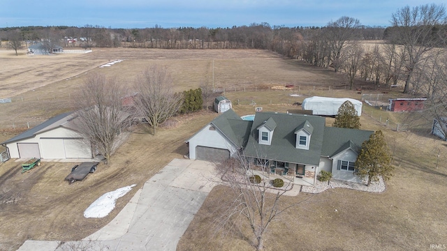 birds eye view of property with a rural view