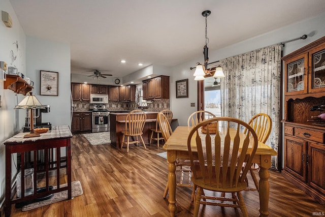 dining area featuring a ceiling fan, dark wood-style flooring, and recessed lighting