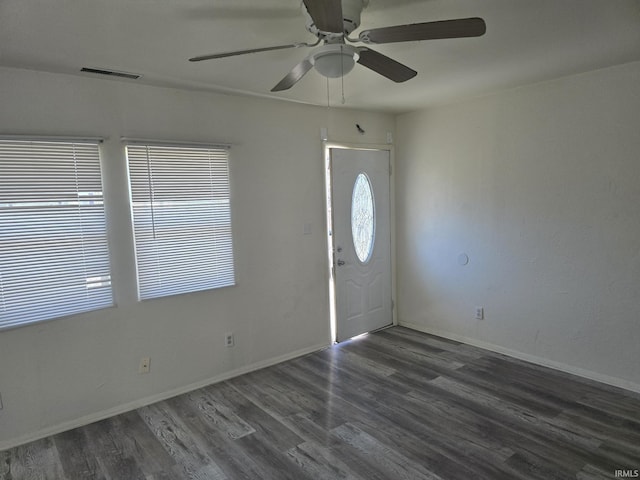 entryway featuring visible vents, a ceiling fan, baseboards, and wood finished floors