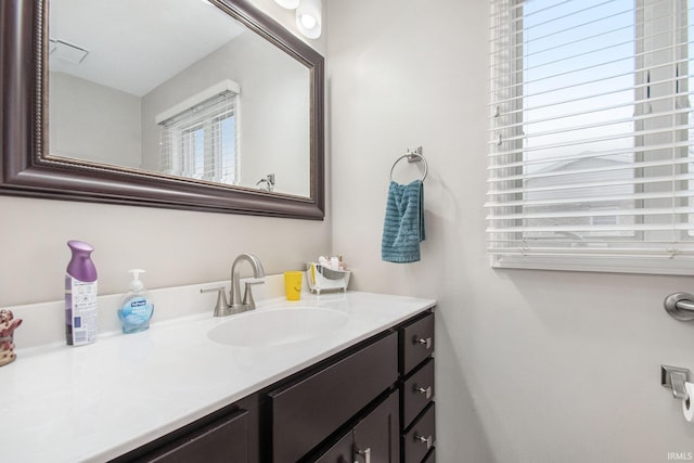 bathroom featuring plenty of natural light and vanity