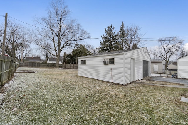 view of yard with a fenced backyard and an outbuilding