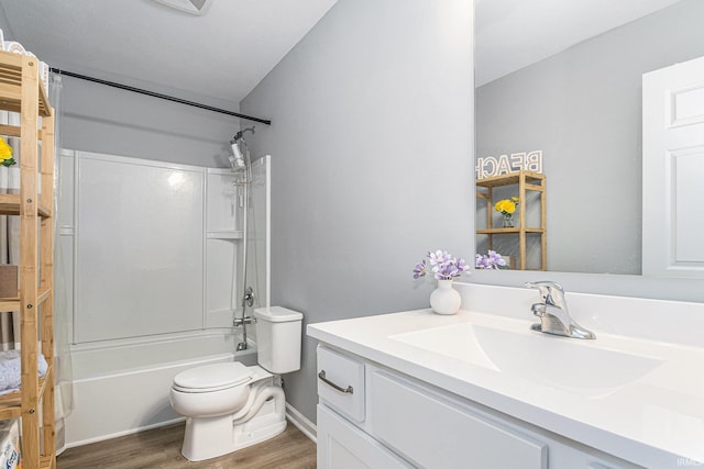 full bathroom with shower / tub combination, vanity, toilet, and wood finished floors