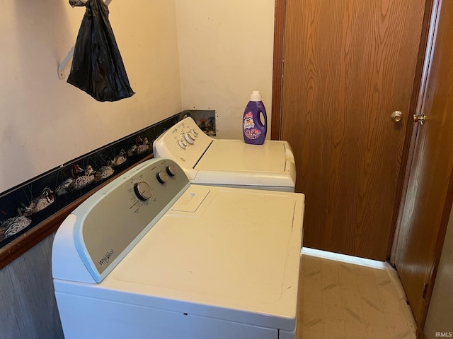 clothes washing area with laundry area and separate washer and dryer