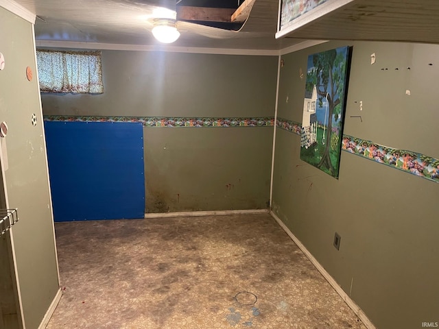 unfurnished room featuring baseboards