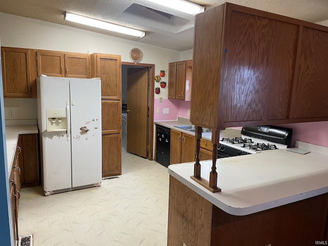 kitchen featuring range with gas stovetop, dishwasher, brown cabinetry, light floors, and white fridge with ice dispenser