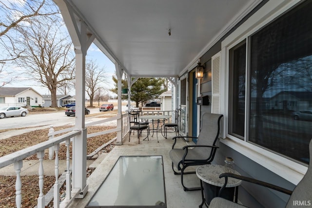 view of patio with a residential view and a porch