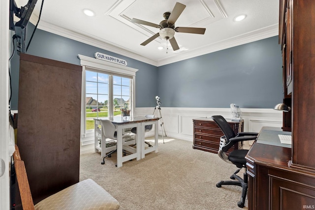 carpeted home office featuring a wainscoted wall, a ceiling fan, crown molding, and recessed lighting