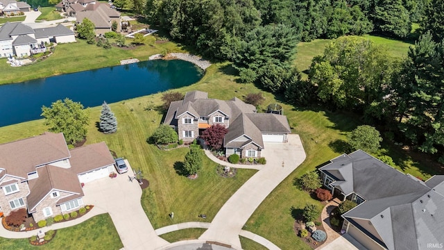 birds eye view of property featuring a residential view and a water view