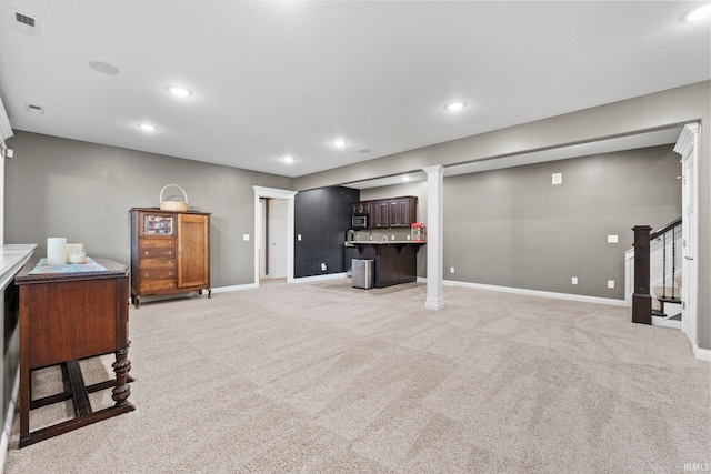 living room with light carpet, visible vents, stairway, and recessed lighting