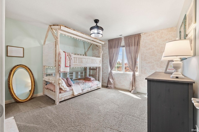 unfurnished bedroom featuring carpet flooring, visible vents, and baseboards