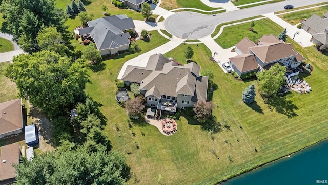 birds eye view of property with a residential view and a water view