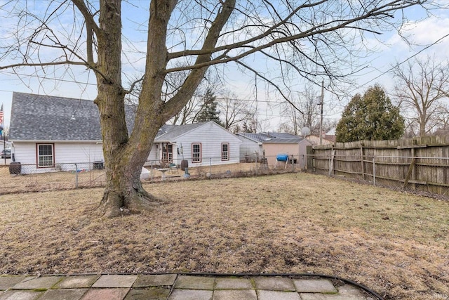 view of yard with a fenced backyard